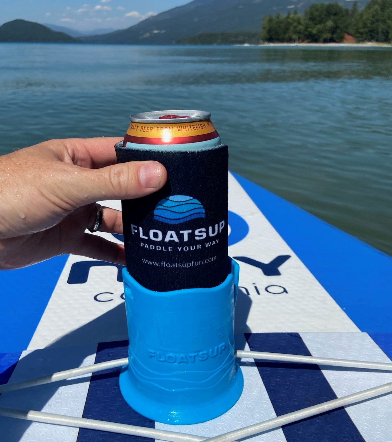 A Floatsup coozie on a can in a Floatsup cup.